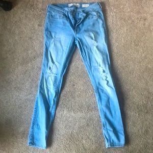 Low-rise light blue ripped skinny jeans